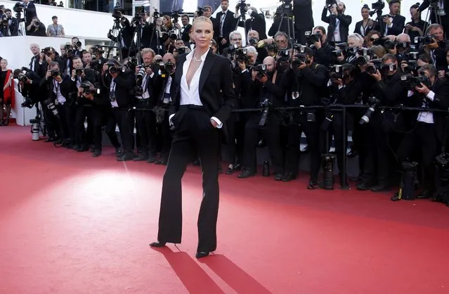 Cast member Charlize Theron poses on red carpet as they arrive for the screening of the film “The Last Face” in competition at the 69th Cannes Film Festival in Cannes, France, May 20, 2016. (Photo by Eric Gaillard/Reuters)