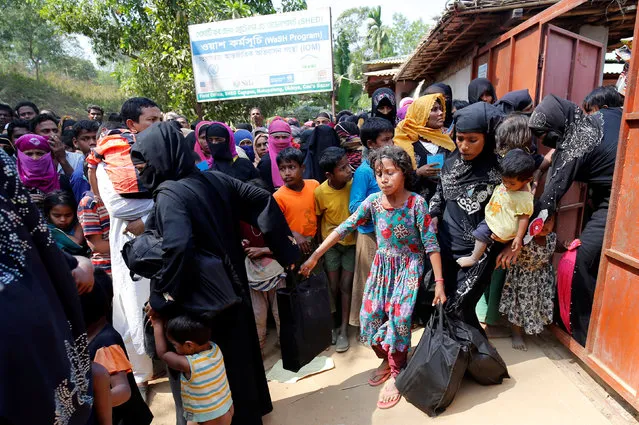 Rohingya refugees collect aid supplies including food and medicine, sent from Malaysia at Kutupalang Unregistered Refugee Camp in Cox’s Bazar, Bangladesh, February 15, 2017. (Photo by Mohammad Ponir Hossain/Reuters)