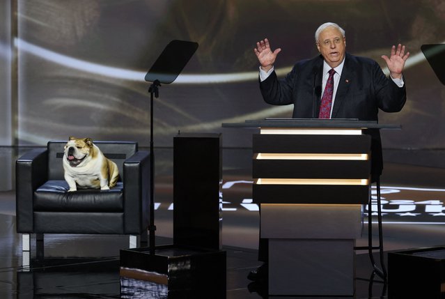 Gov. of West Virginia Jim Justice speaks accompanied by Babydog on Day 2 of the RNC in Milwaukee on July 16, 2024. (Photo by Mike Segar/Reuters)