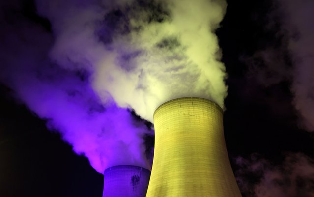 A general view of the Drax Power Station, illuminated in the colours of the Ukrainian flag, in North Yorkshire, Britain on April 1, 2022. (Photo by Lee Smith/Reuters)