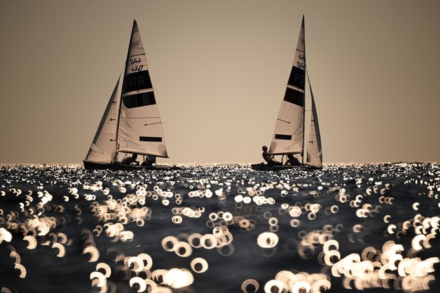 Elena Berta and Bruno Festa of Team Italy and Diogo Costa and Carolina Joao of Team Portugal compete in the Mixed Dinghy 470 class on day ten of the Olympic Games Paris 2024 at Marseille Marina on August 05, 2024 in Marseille, France. (Photo by Clive Mason/Getty Images)