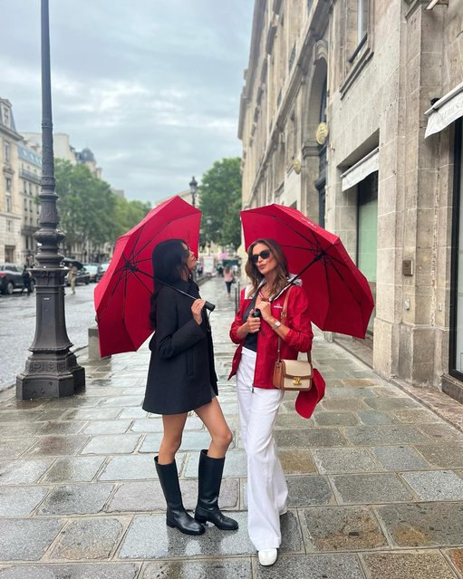 In Paris for the Olympics early August 2024, American models Cindy Crawford (right) and daughter Kaia Gerber, 22, keep dry in style. (Photo by Cindy Crawford/Instagram)