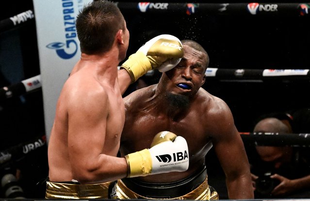 Uzbekistan's Madiyar Saydrakhimov (L) fights Cuba's Julio Cesar La Cruz during the 92 kg boxing match of the Night of Champions by the International Boxing Association (IBA) in Habana on August 27, 2024. Two-time Olympic champion Julio César La Cruz closed on Tuesday with a flourish for Cuban boxing at the six-fight IBA lineup held in Havana, which marked the return of professional boxing to the island after more than five decades of absence. (Photo by Yamil Lage/AFP Photo)