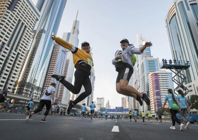 Participants at the Dubai Run at Sheikh Zayed Road in Dubai, United Arab Emirates on November 26, 2021. (Photo by Ruel Pableo for The National)