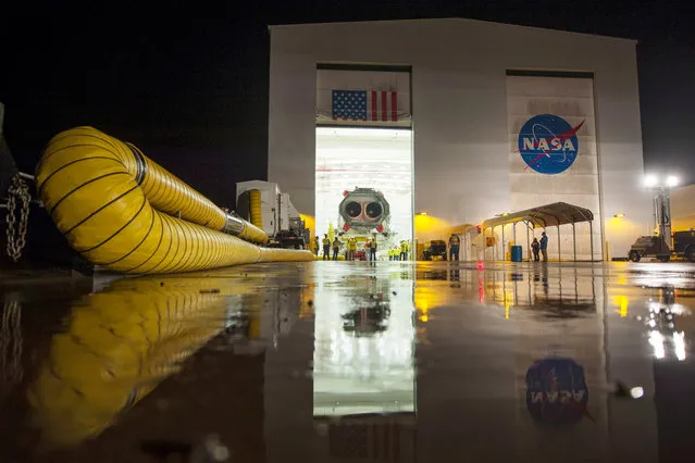 The Orbital Sciences Corporation Antares rocket, with the Cygnus spacecraft onboard, is rolled out of the Horizontal Integration Facility (HIF) to the launch pad on at NASA's Wallops Flight Facility, Wallops Island, Virginia, on Jule 10, 2014. (Photo by Bill Ingalls/NASA via Getty Images)