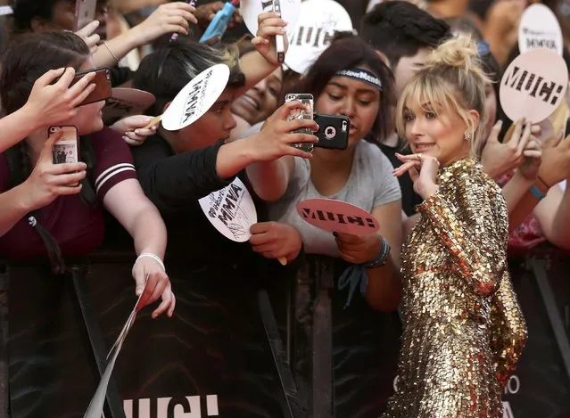 Model Hailey Baldwin poses for photos as she arrives at the iHeartRadio Much Music Video Awards (MMVAs) in Toronto, Ontario, Canada June 19, 2016. (Photo by Peter Power/Reuters)
