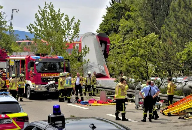 Numerous emergency and rescue forces are in action after a serious train accident in Garmisch-Partenkirchen, Germany, Friday, June 3, 2022. According to the authorities, at least three people have been killed and many injured. (Photo by Josef Hornsteiner/dpa via AP Photo)