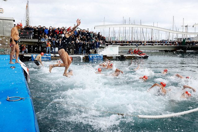 Participants jump into the sea during the Copa Nadal (Christmas Cup) swimming race in Barcelona, Spain on December 25, 2024. (Photo by Bruna Casas/Reuters)