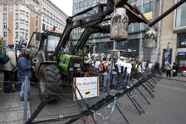 Farmers and dairy farmers from all over Europe take part in a demonstration outside an European Union farm ministers emergency meeting at the EU Council headquarters in Brussels, Belgium, September 7, 2015. (Photo by Jacky Naegelen/Reuters)