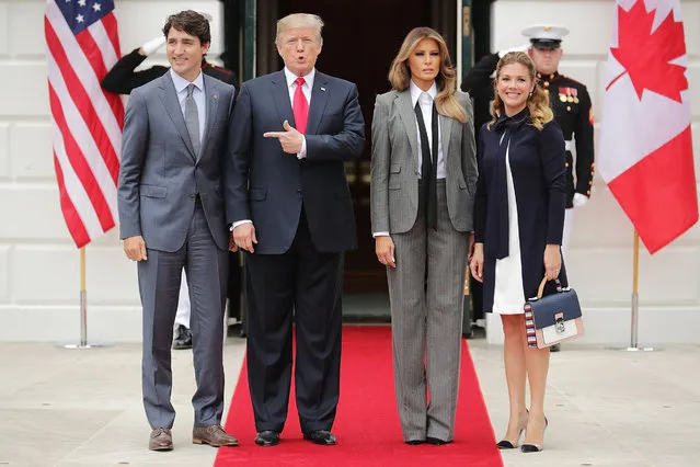 (L-R) Canadian Prime Minister Justin Trudeau, U.S. President Donald Trump, first lady Melania Trump and Sophie Gregoire Trudeau pose for photographs at the White House October 11, 2017 in Washington, DC. The United States, Canada and Mexico are currently engaged in renegotiating the 25-year-old North American Free Trade Agreement. (Photo by Chip Somodevilla/Getty Images)