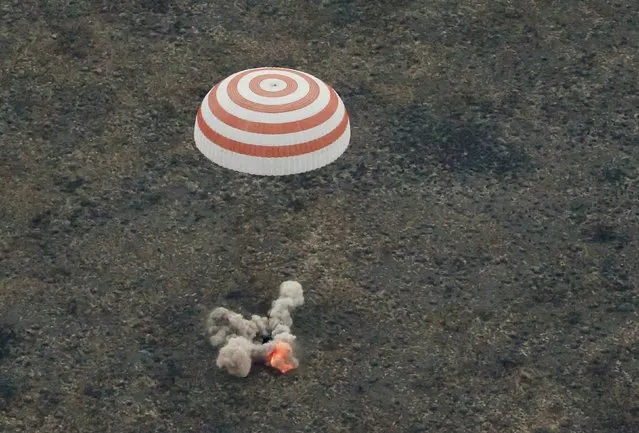 The Soyuz TMA-16M capsule carrying the crew of Gennady Padalka of Russia, Aidyn Aimbetov of Kazakhstan and Andreas Mogensen of Denmark, is seen as it lands near the town of Dzhezkazgan (Zhezkazgan), Kazakhstan, September 12, 2015. (Photo by Yuri Kochetkov/Reuters)