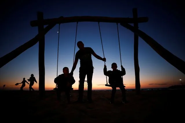 Muslims celebrate the Eid al-Fitr holiday on the beach as authorities ease coronavirus disease (COVID-19) restrictions, in Ashkelon, southern Israel on May 26, 2020. (Photo by Amir Cohen/Reuters)