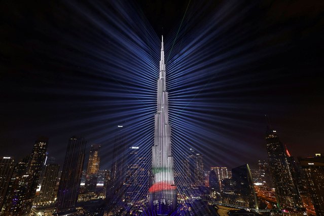 The colors of the United Arab Emirates flag are projected onto the Burj Khalifa, the tallest building in the world, during New Year's Eve celebrations in Dubai, United Arab Emirates on December 31, 2023. (Photo by Amr Alfiky/Reuters)
