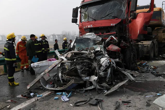 Firefighters work at the site of a pile-up accident on an expressway section in Fuyang city, Anhui province, China November 15, 2017. (Photo by Reuters/China Stringer Network)