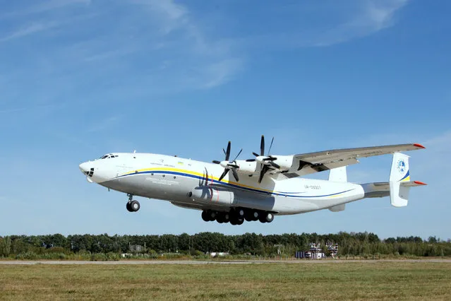 Antonov An-22A “Antei” (Antheus), believed to be the world's largest turboprop-powered aircraft, takes off from the tarmac at the Antonov aircraft plant before the first commercial flight after its renovation in the settlement of Hostomel outside Kiev, Ukraine, September 8, 2016. (Photo by Valentyn Ogirenko/Reuters)