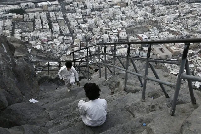 Children from Mecca play atop of of Noor Mountain, where Prophet Muhammad received his first revelation from God to preach Islam, on the outskirts of Mecca, Saudi Arabia, Friday, September 9, 2016. Muslim pilgrims have begun arriving at the holiest sites in Islam ahead of the annual hajj pilgrimage in Saudi Arabia. (Photo by Nariman El-Mofty/AP Photo)
