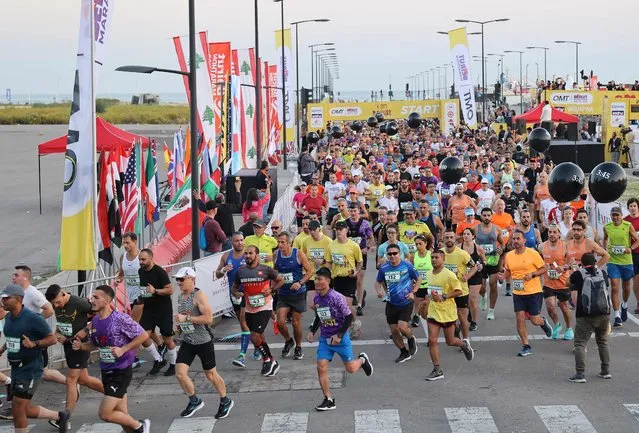 Competitors take part in the annual Beirut Marathon, in the Lebanese capital, on November 13, 2022. (Photo by Anwar Amro/AFP Photo)