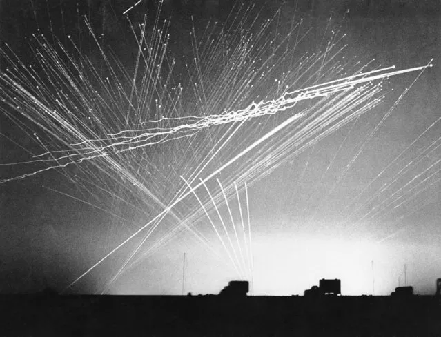 Fire from anti-aircraft batteries made this pattern of light as enemy raiders attacked an RAF landing field somewhere in the Western Desert, October 3, 1942. One enemy aircraft was shot down on this North African raid. (Photo by AP Photo)