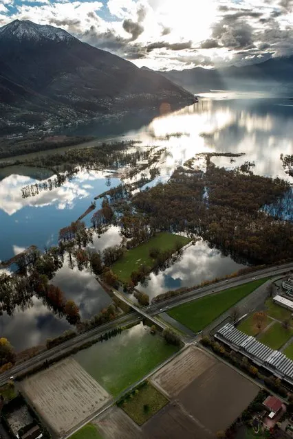 In this November 16, 2014 picture an  aerial view shows the floods at Lake  Maggiore near Mogadino, in southern Switzerland. Heavy rainfalls caused flooding in southern France, northern Italy and  landslides in southern Switzerland. (Photo by Gabriele Putzu/AP Photo/Keystone/Ti Press)