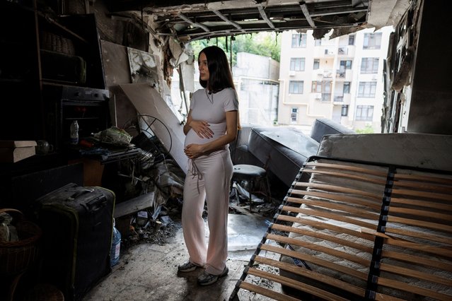 Bohdana Zhupanyna, a 30-year-old mother-to-be, stands inside of her apartment damaged by a Russian drone strike, amid Russia's attack on Ukraine, in Kyiv, Ukraine on July 23, 2025. (Photo by Valentyn Ogirenko/Reuters)