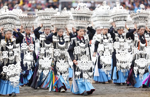 People dressed in traditional costumes of Yi ethnic group parade on the opening ceremony of a torch festival in Butuo County, southwest China's Sichuan Province, July 22, 2025. (Photo by Xinhua News Agency/Rex Features/Shutterstock)