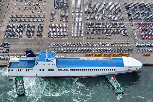 Cars for export waiting to be loaded onto a ship are seen at a port in Yantai, in eastern China's Shandong province on June 29, 2025. (Photo by AFP Photo/China Stringer Network)