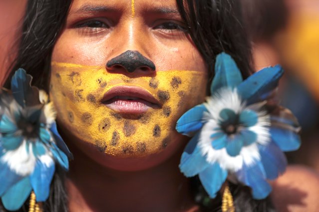 An Indigenous woman attends the 20th annual Free Land Indigenous Camp in Brasilia, Brazil, Monday, April 22, 2024. The 7-day event aims to show the unity of Brazil's Indigenous peoples in their fight for the demarcation of their lands and their rights. (Photo by Luis Nova/AP Photo)