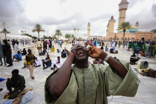 Nearly two million people gathers to commemorate the spiritual rank believed to have been attained by Sheikh Ahmadou Bamba, founder of the Mouride Sufi order, during his exile by the French colonial administration, in Touba, Senegal on August 13, 2025. The event, known as the 'Grand Magal (Celebration of Praise)', is held annually on the 18th day of the Islamic month of Safar. This year marks the 131st observance of the pilgrimage. Followers honor the occasion by visiting the Great Mosque of Touba and the tomb of Sheikh Ahmadou Bamba to perform prayers and pay their respects. (Photo by Cem Ozdel/Anadolu via Getty Images)