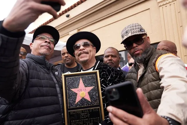 US actor and musician Ice-T (C) poses for a photograph after he is honored with a Hollywood Walk of Fame star in Los Angeles, California, USA, 17 February 2023. Ice-T's star, in the Recording category, is the 2,747th star on the Hollywood Walk of Fame. (Photo by Allison Dinner/EPA)