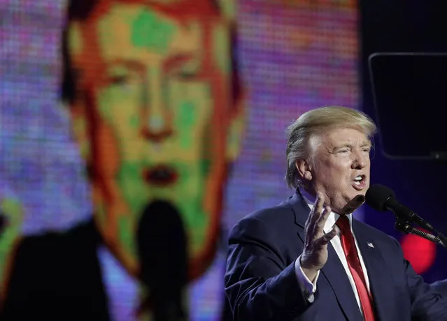 Republican presidential candidate Donald Trump is seen on a large screen as he speaks during a charity event hosted by the Republican Hindu Coalition, Saturday, October 15, 2016, in Edison, N.J. (Photo by Julio Cortez/AP Photo)