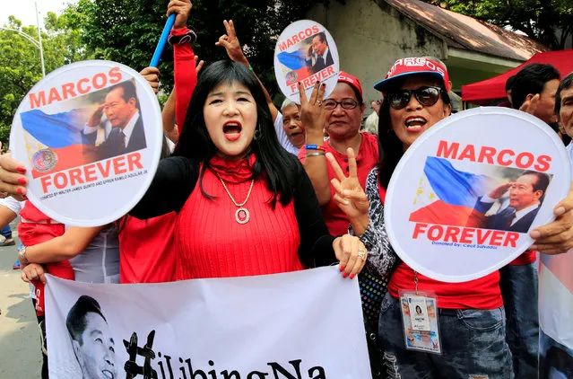Supporters wave banners and signs with the image of the late dictator Ferdinand Marcos, as they wait for the decision of the justices on the proposed hero's burial for Marcos at the Libingan ng mga Bayani (Hereos cemetery), which was deferred on November 8, during a rally in front of the Supreme Court in metro Manila, Philippines October 18, 2016. (Photo by Romeo Ranoco/Reuters)