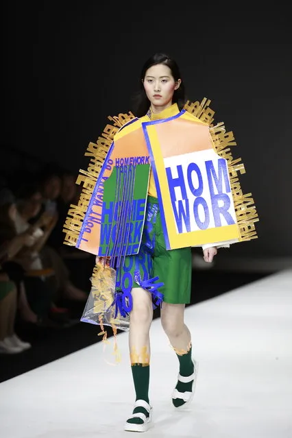 Models show creations by Chinese graduates from the China Academy of Art School of Design during the Show Town China Graduate Fashion Week in Beijing, China, 13 May 2018. (Photo by How Hwee Young/EPA/EFE)
