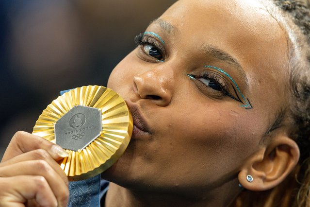 Gold medalist Rebeca Andrade of Team Brazil kisses her medal after the Artistic Gymnastics Women's Floor Exercise Medal Ceremony on day ten of the Olympic Games Paris 2024 at Bercy Arena on August 05, 2024 in Paris, France. (Photo by Rodolfo Buhrer/Eurasia Sport Images/Getty Images)