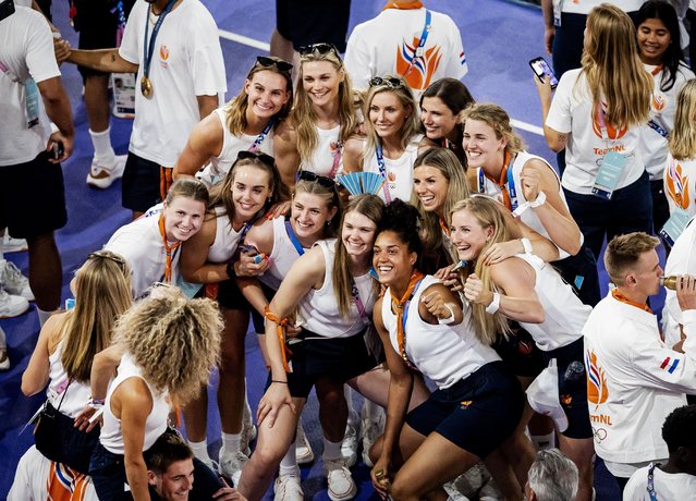 Athletes from Team Netherlands take photos of each other during the closing ceremony of the Paris 2024 Olympic Games at the Stade de France, in Saint-Denis, in the outskirts of Paris, on August 11, 2024. (Photo by Hollandse Hoogte/Rex Features/Shutterstock)