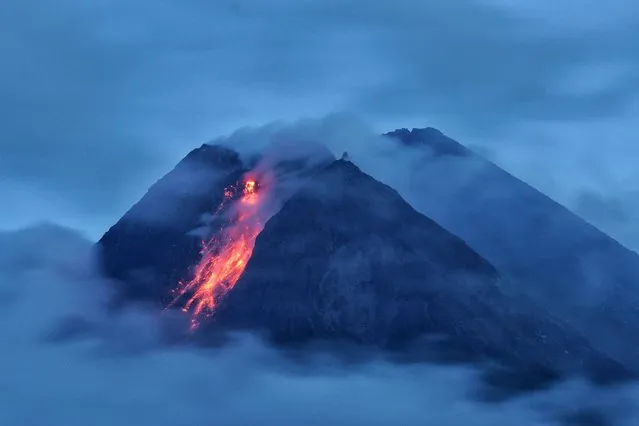 Mount Semeru volcano spews hot lava as it erupts, as seen from Oro-oro Ombo village in Lumajang, East Java province, Indonesia, January 17, 2021. (Photo by Zabur Karuru/Antara Foto via Reuters)