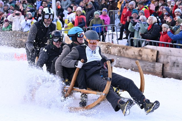 Competitors ride their wooden sledge during the traditional Bavarian horn sledge race “Hornschlittenrennen” in Garmisch-Partenkirchen, Germany, on January 6, 2025. (Photo by Angelika Warmuth/Reuters)