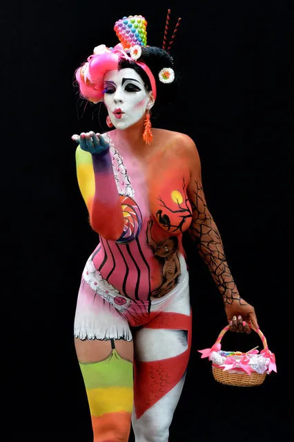 A participant poses with her body paintings designed by bodypainting artist Helena Jordana during the 16th World Bodypainting Festival in Poertschach on July 6, 2013 in Poertschach am Woerthersee, Austria. (Photo by Didier Messens/Getty Images)