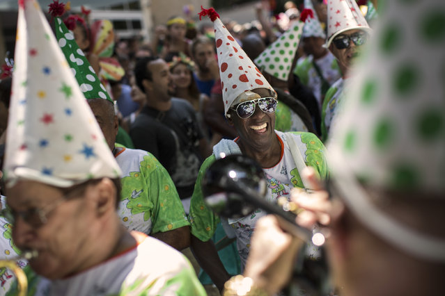 Revelers perform during the “Gigantes da Lira” carnival parade in Rio de Janeiro, Brazil, Sunday, February 8, 2015. (Photo by Felipe Dana/AP Photo)
