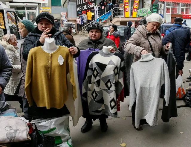 Street vendors sell warm clothes in central Chisinau, Moldova, November 12, 2016. (Photo by Gleb Garanich/Reuters)