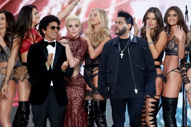 Musicians Bruno Mars (3rdL), Lady Gaga (4thL) and The Weeknd (3rdR) appear with models at the end of the 2016 Victoria's Secret Fashion Show at the Grand Palais in Paris, France, November 30, 2016. (Photo by Charles Platiau/Reuters)