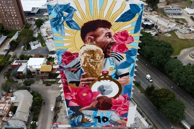 Aerial view of a giant mural by artist Cobre depicting Argentina football player Lionel Messi with the World Cup Trophy on June 29, 2023 in Santa Fe, Argentina. Street artist Cobre is working on a record breaking 75 meter tall mural to honor Lionel Messi. (Photo by Leandro Vallerino/Getty Images)