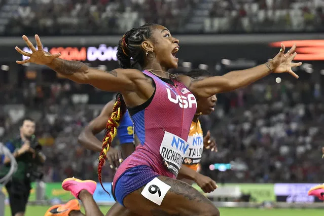 Sha'Carri Richardson, of the United States, spreads her arms as he crosses the line to win gold in the women's 100 meter final during the World Athletics Championships in Budapest, Hungary, Monday, August 21, 2023. (Photo by Denes Erdos/AP Photo)