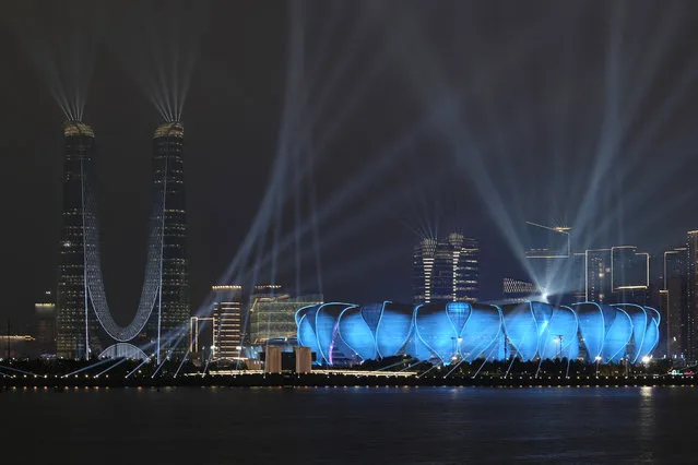 Hangzhou Olympic Sports Center Stadium, the opening ceremony venue for the 19th Asian Games Hangzhou 2022, is lit up during a light show ahead of the games in Hangzhou, Zhejiang province, China on September 21, 2023. (Photo by Tingshu Wang/Reuters)
