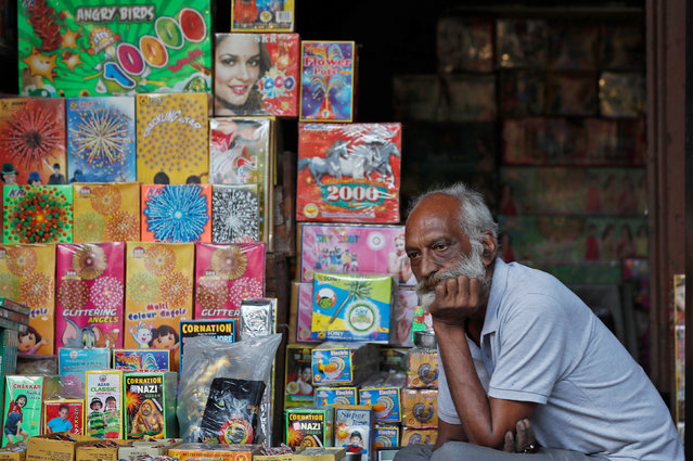 A shopkeeper waits for customers at his firecracker shop in the old quarters of Delhi, India, October 17, 2018. (Photo by Adnan Abidi/Reuters)
