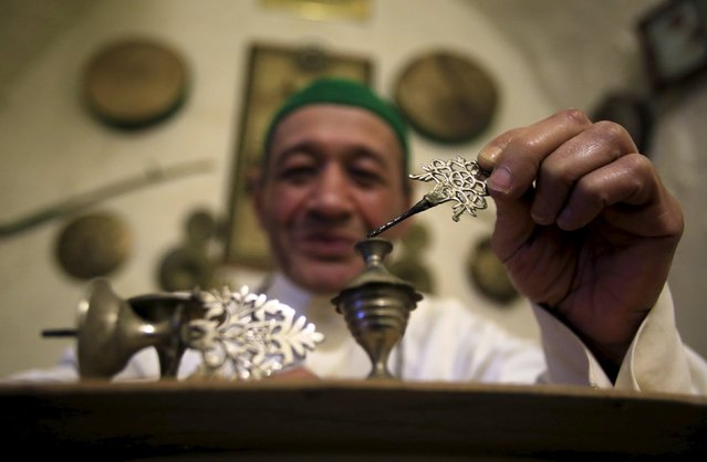 Mohamed Fnas, who serves as a Musaharaty (dawn awakener) during Ramadan, applies traditional kohl eyeliner in the port city of Sidon, southern Lebanon January 22, 2016. Many Muslim men get their eyes smeared with traditional Kohl eyeliner for religious reason. (Photo by Ali Hashisho/Reuters)