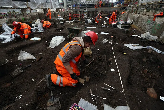 An archaeologist from the Museum of London works on the Bedlam burial ground where it is believed over 20,000 Londoners were buried between 1569 and 1738, on March 17, 2015 in London, England. The excavation is part of the ongoing Crossrail construction works to facilitate an entrance to the new Liverpool Street Crossrail ticket station. (Photo by Carl Court/Getty Images)