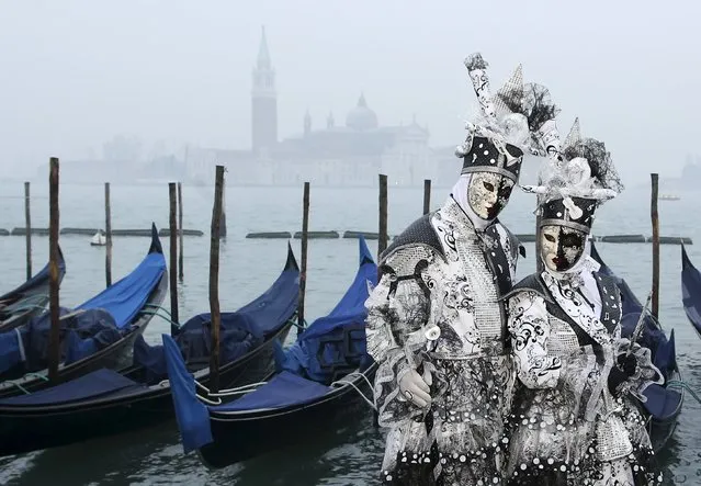 Masked revellers pose during the Venice Carnival, in San Marco Piazza January 30, 2016. (Photo by Alessandro Bianchi/Reuters)