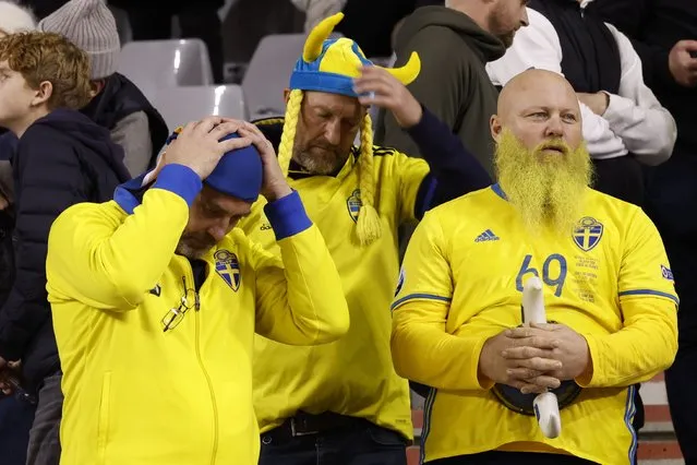 Sweden supporters wait on the stands after suspension of the Euro 2024 group F qualifying soccer match between Belgium and Sweden at the King Baudouin Stadium in Brussels, Monday, October 16, 2023. The match was abandoned at halftime after two Swedes were killed in a shooting in central Brussels before kickoff. (Photo by Geert Vanden Wijngaert/AP Photo)