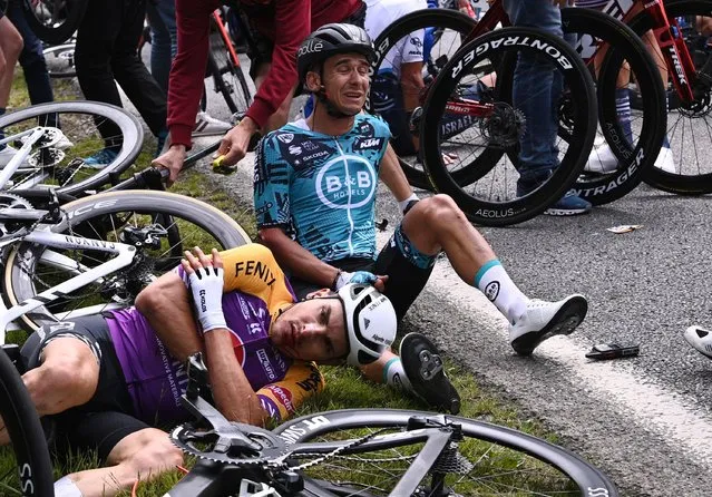 Bryan Coquard of France and Team B&B Hotels p/b KTM & Kristian Sbaragli of Italy and Team Alpecin-Fenix injury after crash during the 108th Tour de France 2021, Stage 1 a 197,8km stage from Brest to Landerneau on June 26, 2021 in Landerneau, France. (Photo by Anne-Christine Poujoulat/Reuters)