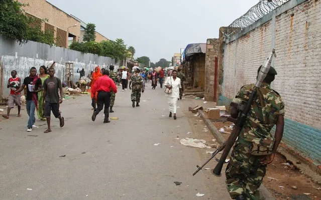 A soldier patrols the streets after a grenade attack of Burundi's capital Bujumbura, February 3, 2016. At least one person was killed in a grenade attack on a bar in Burundi on Monday night, witnesses said, in more violence since the African Union backed away from sending in peacekeepers without the government's consent. (Photo by Jean Pierre Aime Harerimama/Reuters)